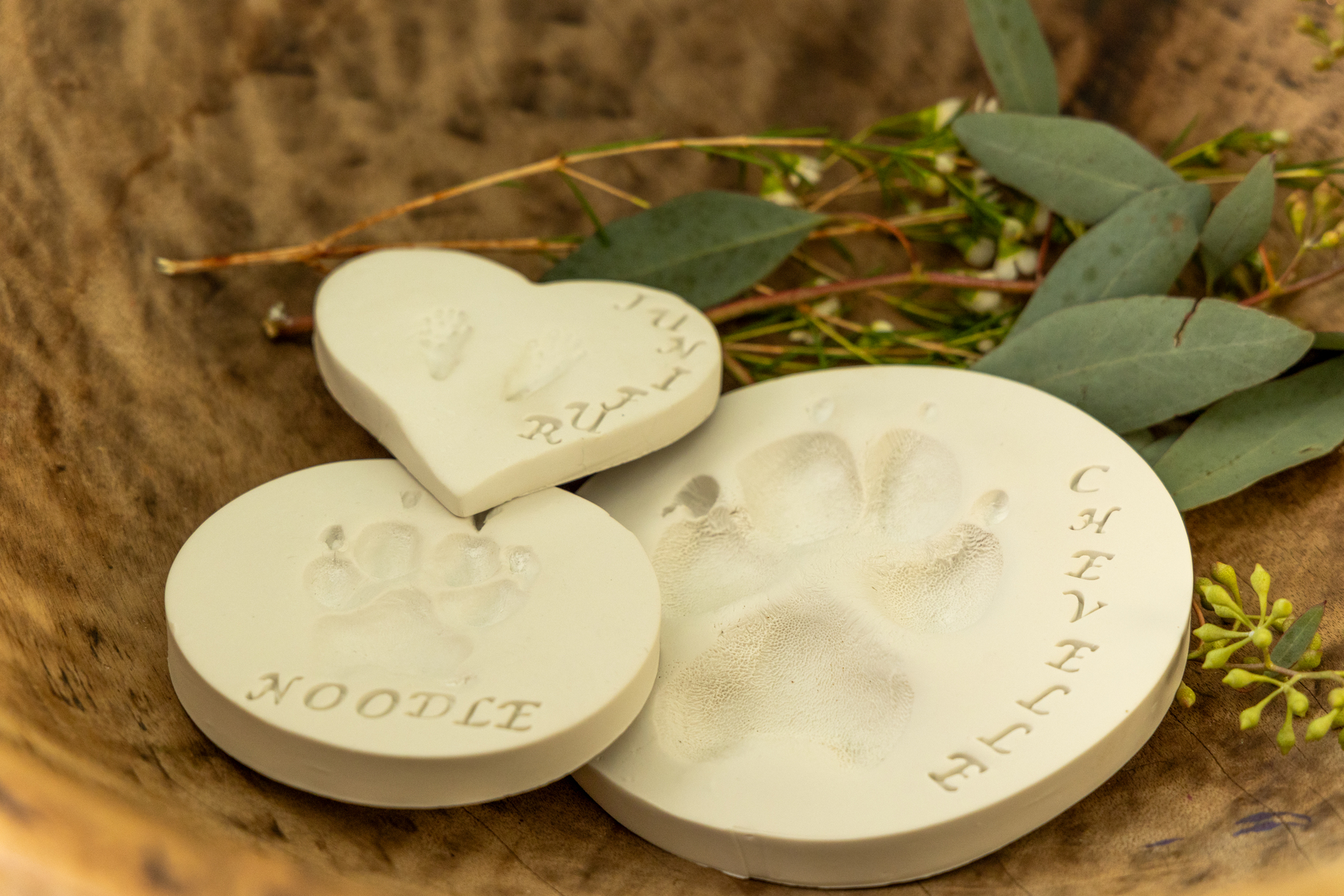 Clay paw print keepsakes with pet names