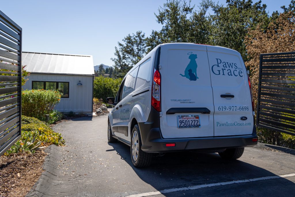 Paws Into Grace service vehicle parked outside a client's home